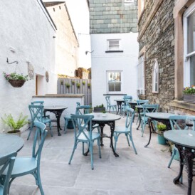 The sheltered courtyard with outdoor café tables